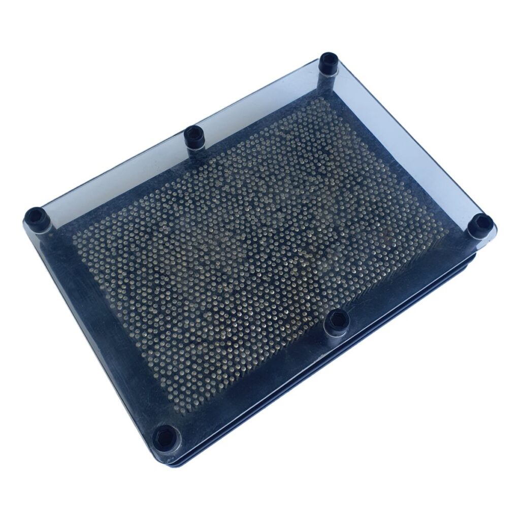 Metal pin art toy creating 3D impressions with movable pins in a clear frame desk toy